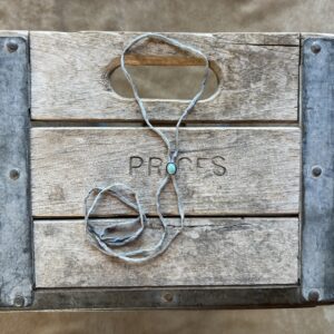 Lone Mountain Turquoise Bolo on a Gray Silk Cord