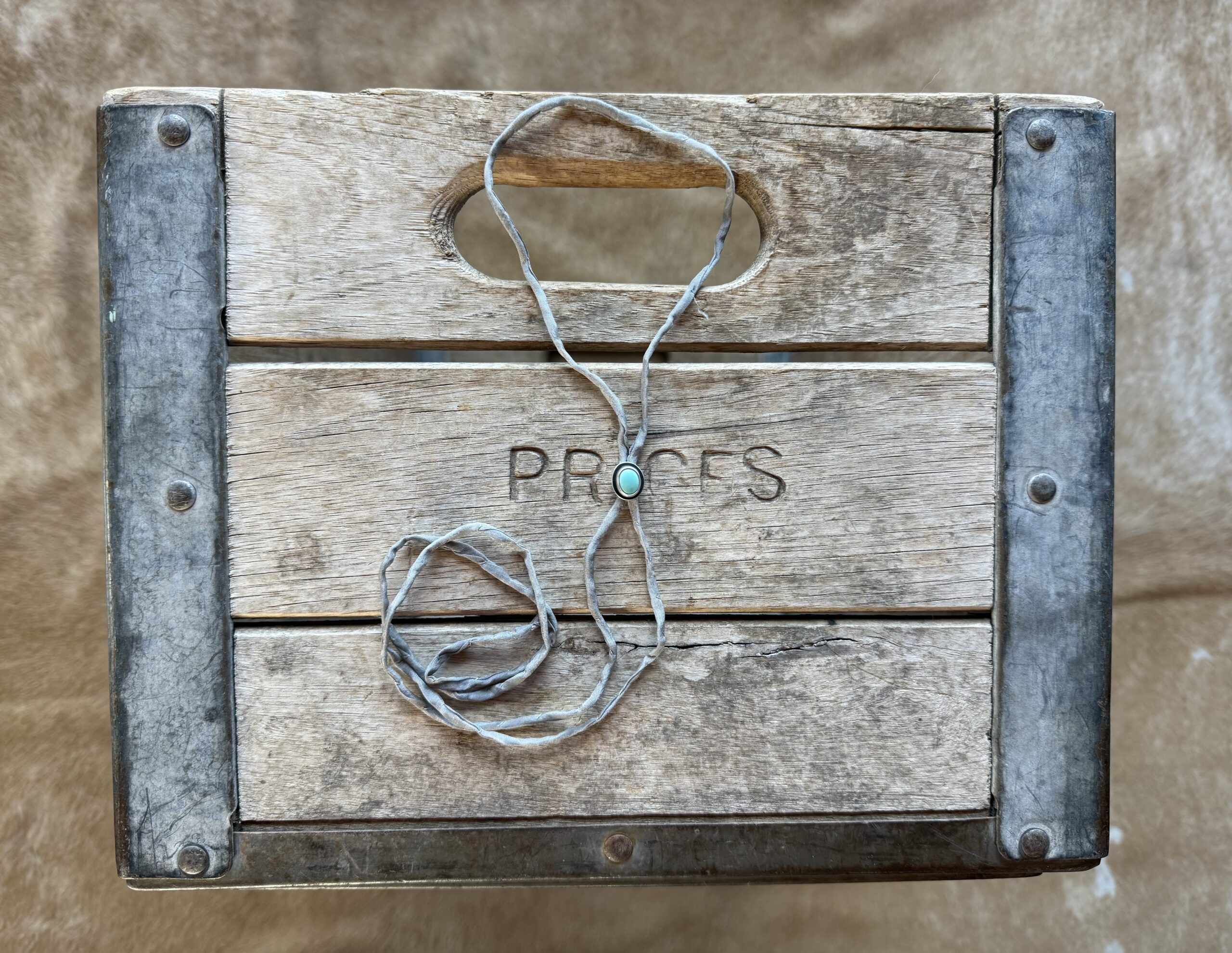 Lone Mountain Turquoise Bolo on a Gray Silk Cord