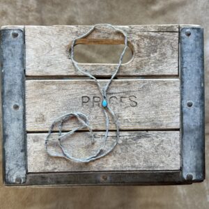 Lone Mountain Turquoise Bolo on a Gray Silk Cord