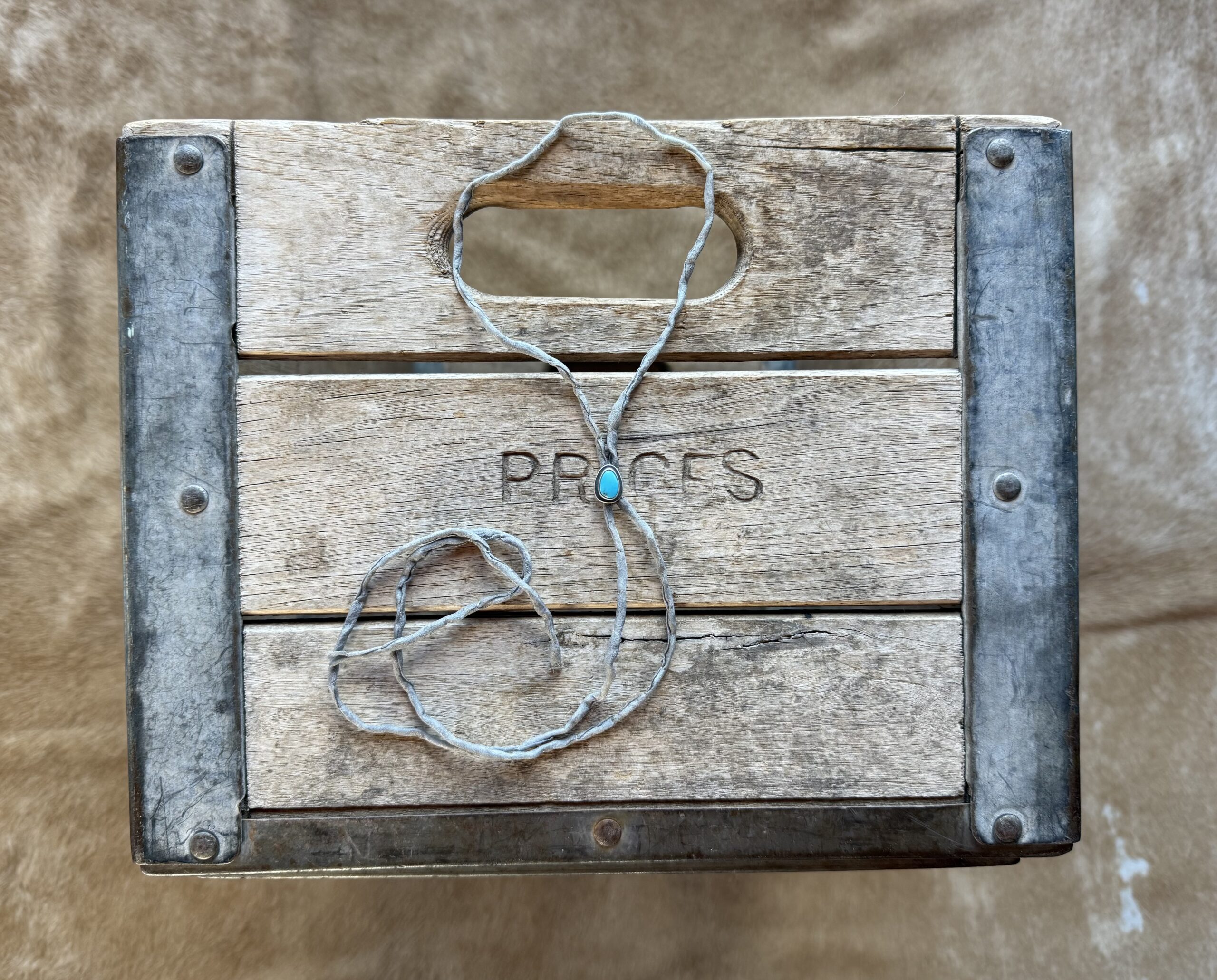 Lone Mountain Turquoise Bolo on a Gray Silk Cord