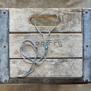 Lone Mountain Turquoise Bolo on a Gray Silk Cord