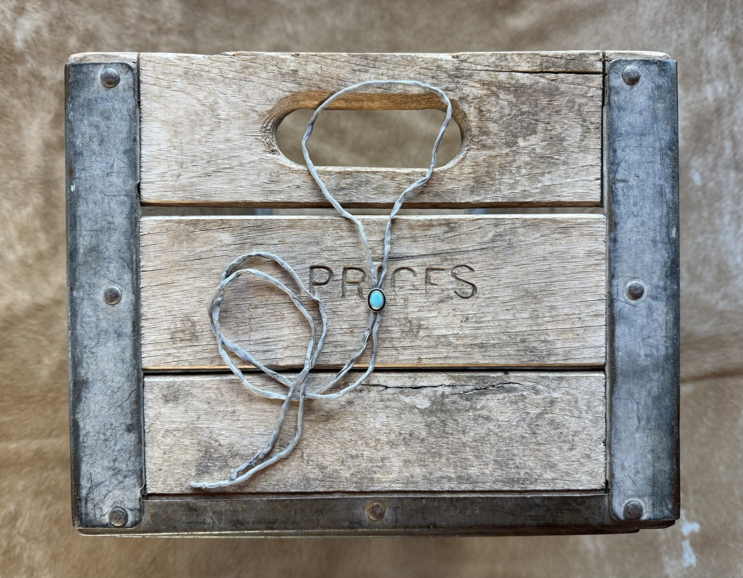 Lone Mountain Turquoise Bolo on a Gray Silk Cord