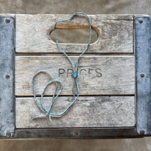 Lone Mountain Turquoise Bolo on a Blue/ Gray Silk Cord